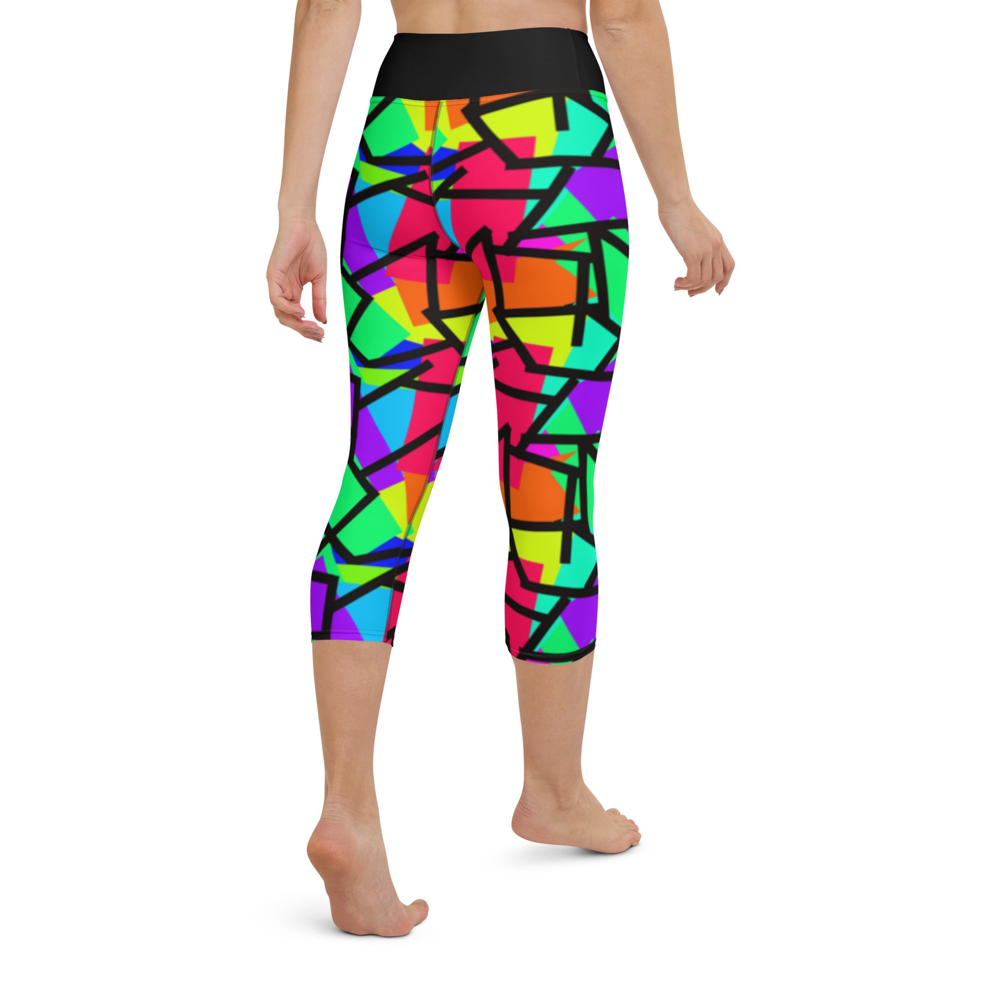 Harajuku Yume Kawaii womens yoga capri leggings in brightly coloured Pop Kei 80s Memphis design in red, orange, green, purple, yellow and turquoise geometric shapes and a black zigzag overlay on these neon funky running tights for women. High waist.