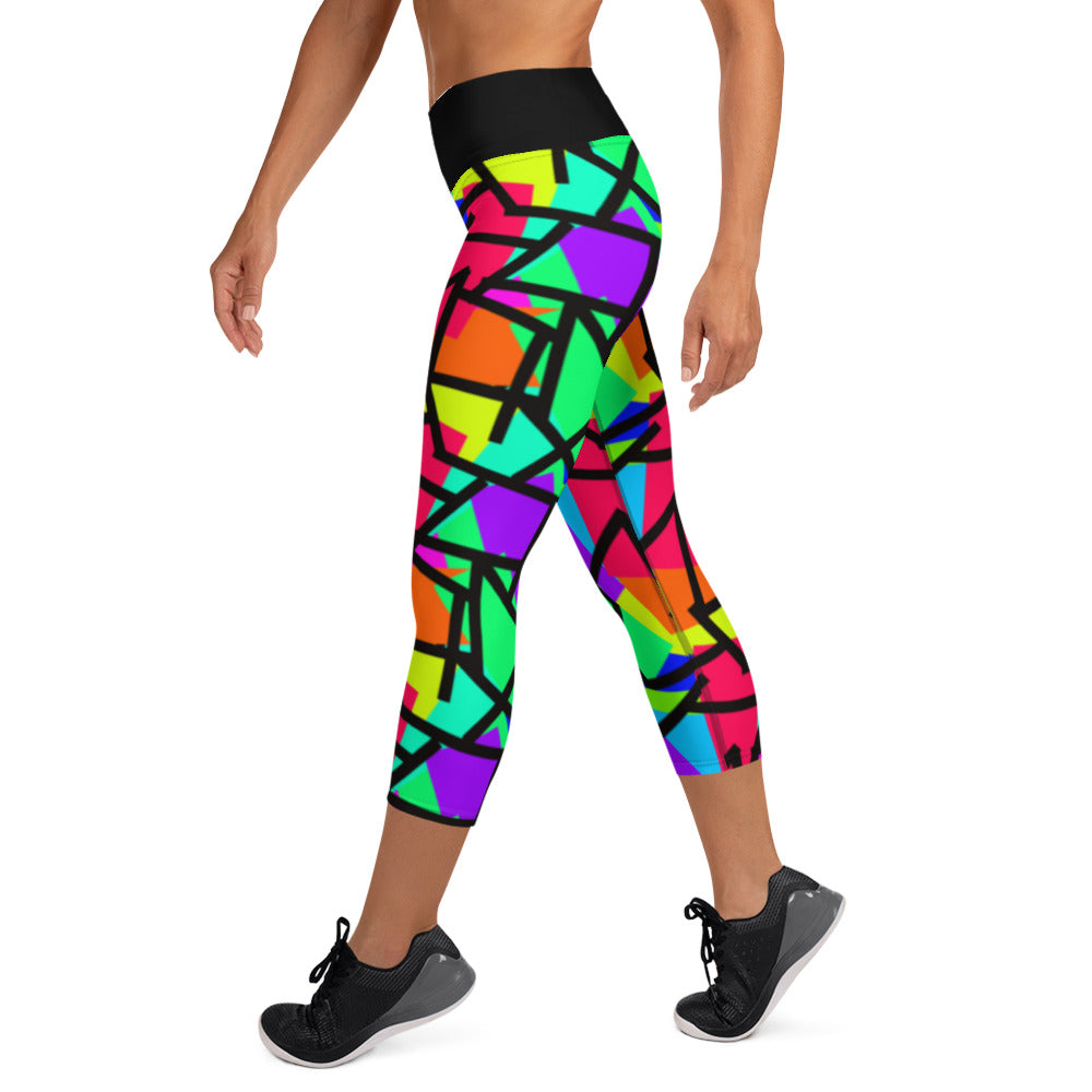 Harajuku Yume Kawaii womens yoga capri leggings in brightly coloured Pop Kei 80s Memphis design in red, orange, green, purple, yellow and turquoise geometric shapes and a black zigzag overlay on these neon funky running tights for women. High waist.