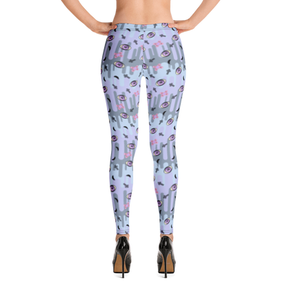 Pastel goth design harajuku leggings for women with a spooky pattern of eyeballs, crosses and black moons against a pastel drip design on these festival pants or running tights for women by BillingtonPix