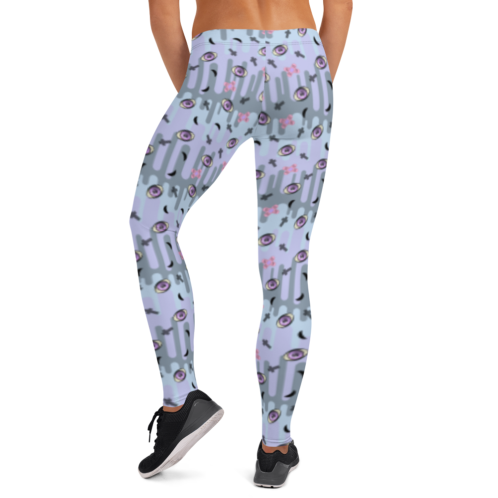 Pastel goth design harajuku leggings for women with a spooky pattern of eyeballs, crosses and black moons against a pastel drip design on these festival pants or running tights for women by BillingtonPix