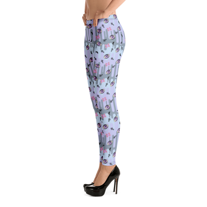 Pastel goth design harajuku leggings for women with a spooky pattern of eyeballs, crosses and black moons against a pastel drip design on these festival pants or running tights for women by BillingtonPix