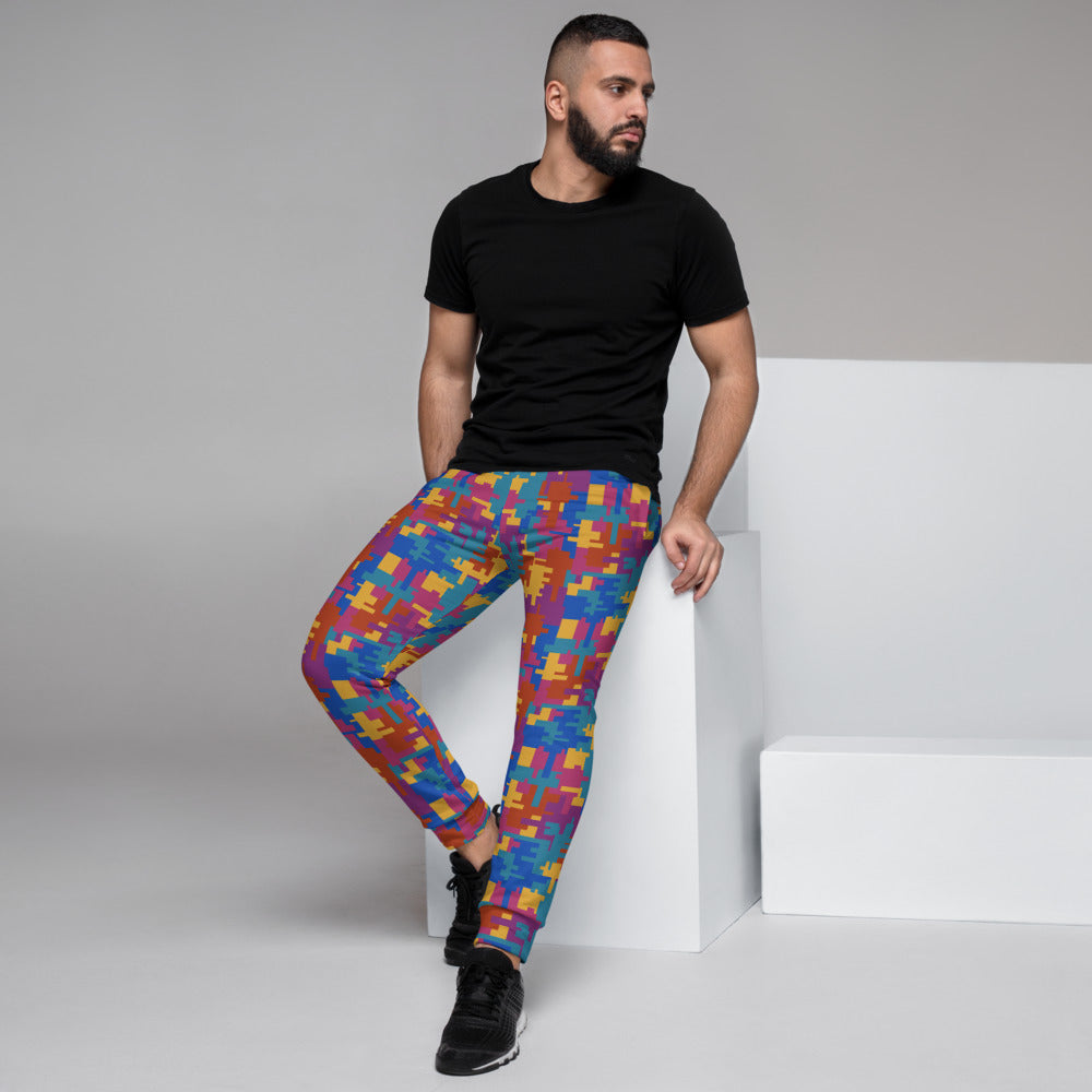 Striking 90s style geometric patterned men's joggers for jogging, running, squatting, gym, lounging or streetwear fashion in multicoloured shapes of teal, mustard, red and magenta by BillingtonPix