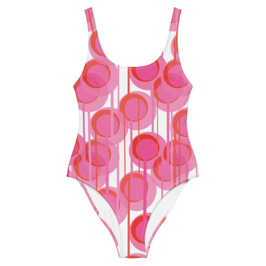 This cheeky, bright and comfortable abstract design patterned swimsuit is entitled Pink Connected Circles and consists of colorful geometric circular shapes in various tones of pink on a white background, connected vertically by narrow tentacles, to form a hanging mobile pattern