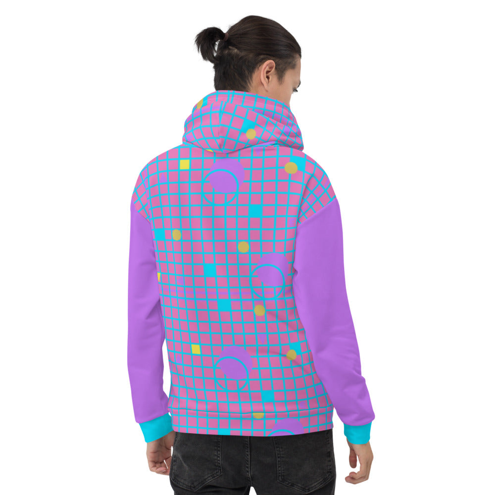 Harajuku geometric patterned unisex hoodie sweater in mauve, pink, blue and yellow, consisting of a grid background in mauve and pink and 80s Memphis design. Arms are in matching mauve purple with turquoise cuffs on these festival hoodies by BillingtonPix