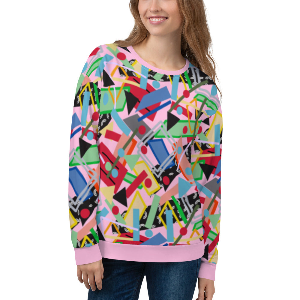 80s memphis style all over print sweatshirt in pink with geometric shapes in a crazy pattern like an arcade carpet. Fun sweater top in green, blue, red and orange two dimensional shapes and colors.