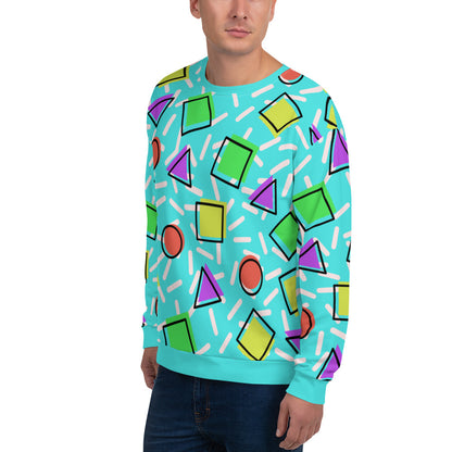 Retro style 80s Memphis design sweatshirt pullover with colourful rainbow primary colors in geometric shapes squares, circles. triangles with a random white pattern below all over a turquoise blue background on this best athleisure sportswear sweatshirt by BillingtonPix