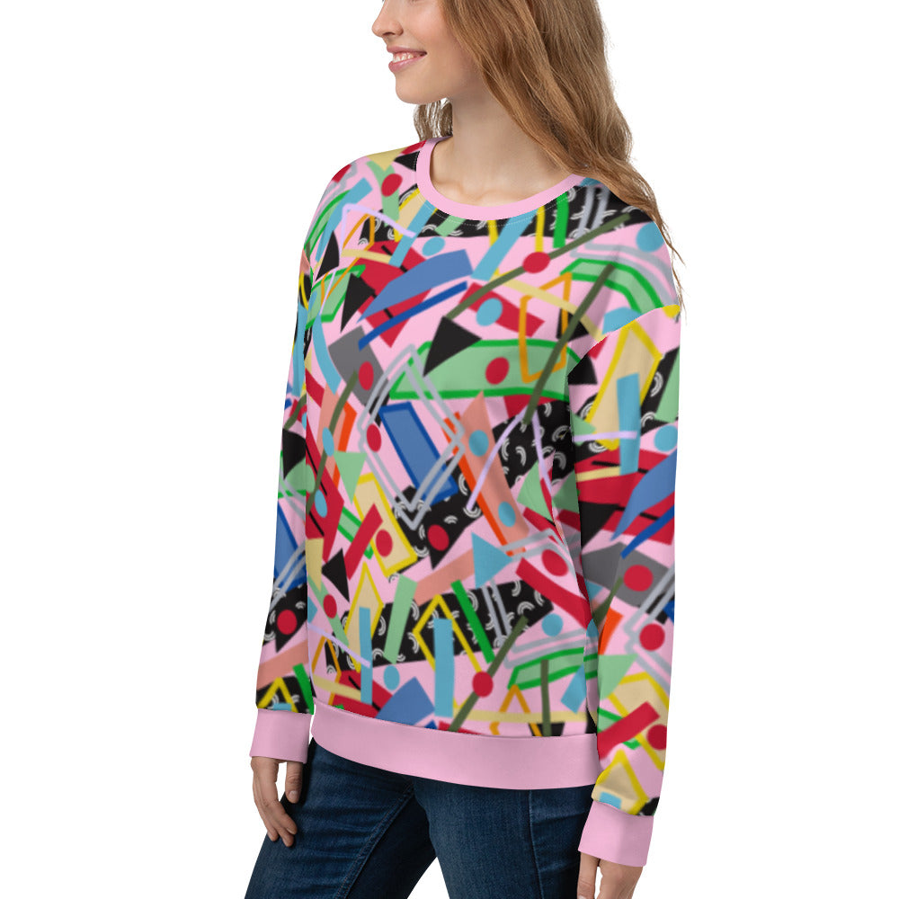 80s memphis style all over print sweatshirt in pink with geometric shapes in a crazy pattern like an arcade carpet. Fun sweater top in green, blue, red and orange two dimensional shapes and colors.