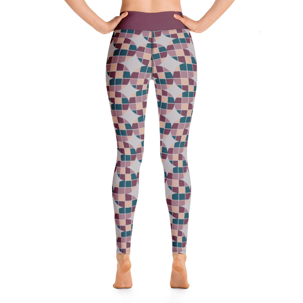 These Midcentury Modern style yoga leggings consists of a mosaic pattern of burgundy, teal, pink and cream in the abstract shape of descending serpents against pale grey background. The high waistband is kept simple, picking out the burgundy colour in these distinctive patterned yoga tights