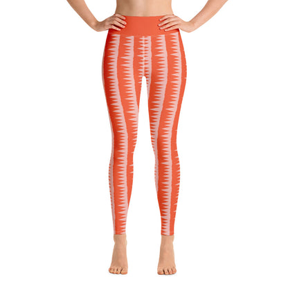 This Mid-Century Modern style yoga leggings pattern consists of colorful pink jagged columns of geometric triangular shapes stacked upon each other like columns against an orange red background. The high waistband is kept simple, picking out the vibrant orange color in these distinctive patterned yoga tights.