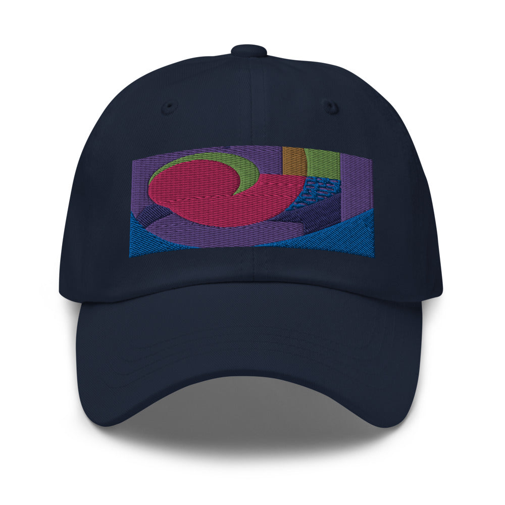 Navy dad hat with colorful rectangular logo containing blocks of colors of pink, purple, green and blue, curves and geometric shapes in a mid-century modernist abstract composition