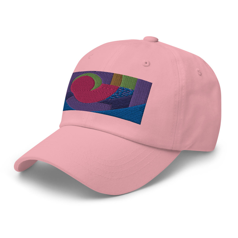 Pink dad hat with colorful rectangular logo containing blocks of colors of pink, purple, green and blue, curves and geometric shapes in a mid-century modernist abstract composition