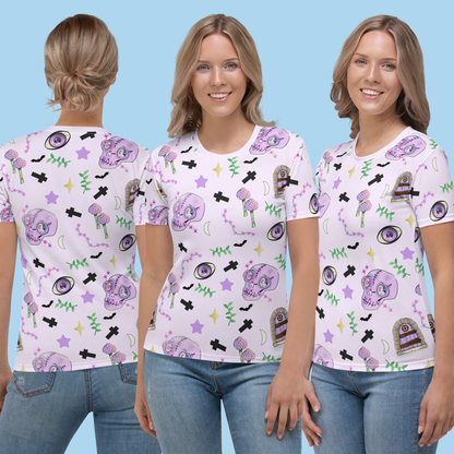 Pastel pink t-shirt for women in Harajuku pastel goth style. Features spooky skulls, crosses, mushrooms , grottos and stars on this Halloween all over print t-shirt by BillingtonPix