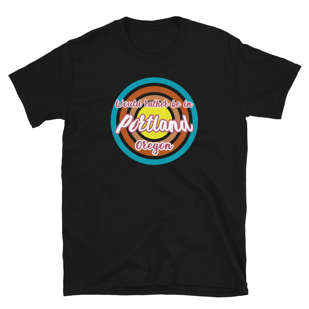 Rather be in Portland Oregon graphic t-shirt design with concentric circles in retro colours of blue, orange, pink and yellow on this black cotton tee by BillingtonPix