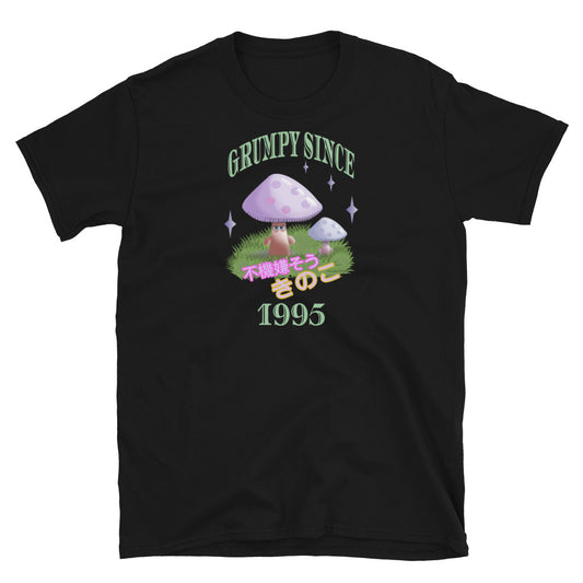 Cute Japanese Kawaii style graphic tee with a cottagecore style theme of woodland mushrooms. Muted tones in a retro vintage 90s Japanese style in pale pinks, mauves and green. These are grumpy mushrooms and the slogan Grumpy Since 1995 and ä¸æ©Ÿå«Œãã†ãªã‚­ãƒŽã‚³ describe this black cotton t-shirt by BillingtonPix